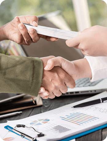 Handshake over business documents