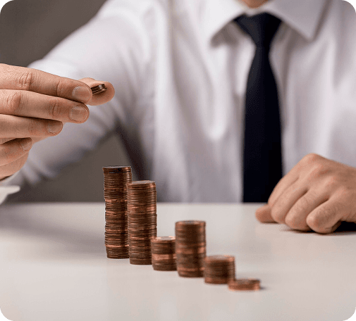 Business person stacking coins
